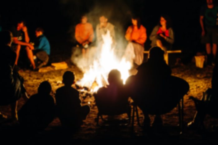 people around a campfire