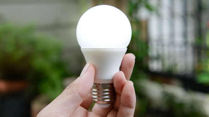 Hand Holding LED Light Bulb