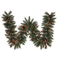 Vickerman 9' Artificial Snow Tipped Pine and Berry Garland with 50 Multi-Color LED Lights