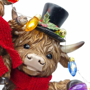 9.8" Highland Cow Family Christmas Figurine Set with Timer - Image 4