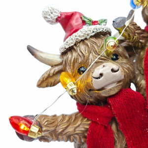 9.8" Highland Cow Family Christmas Figurine Set with Timer - Image 2